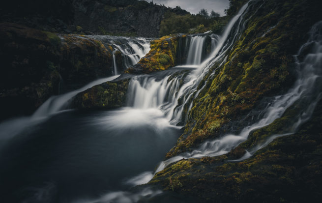 Gjáin natural water pool and waterfall