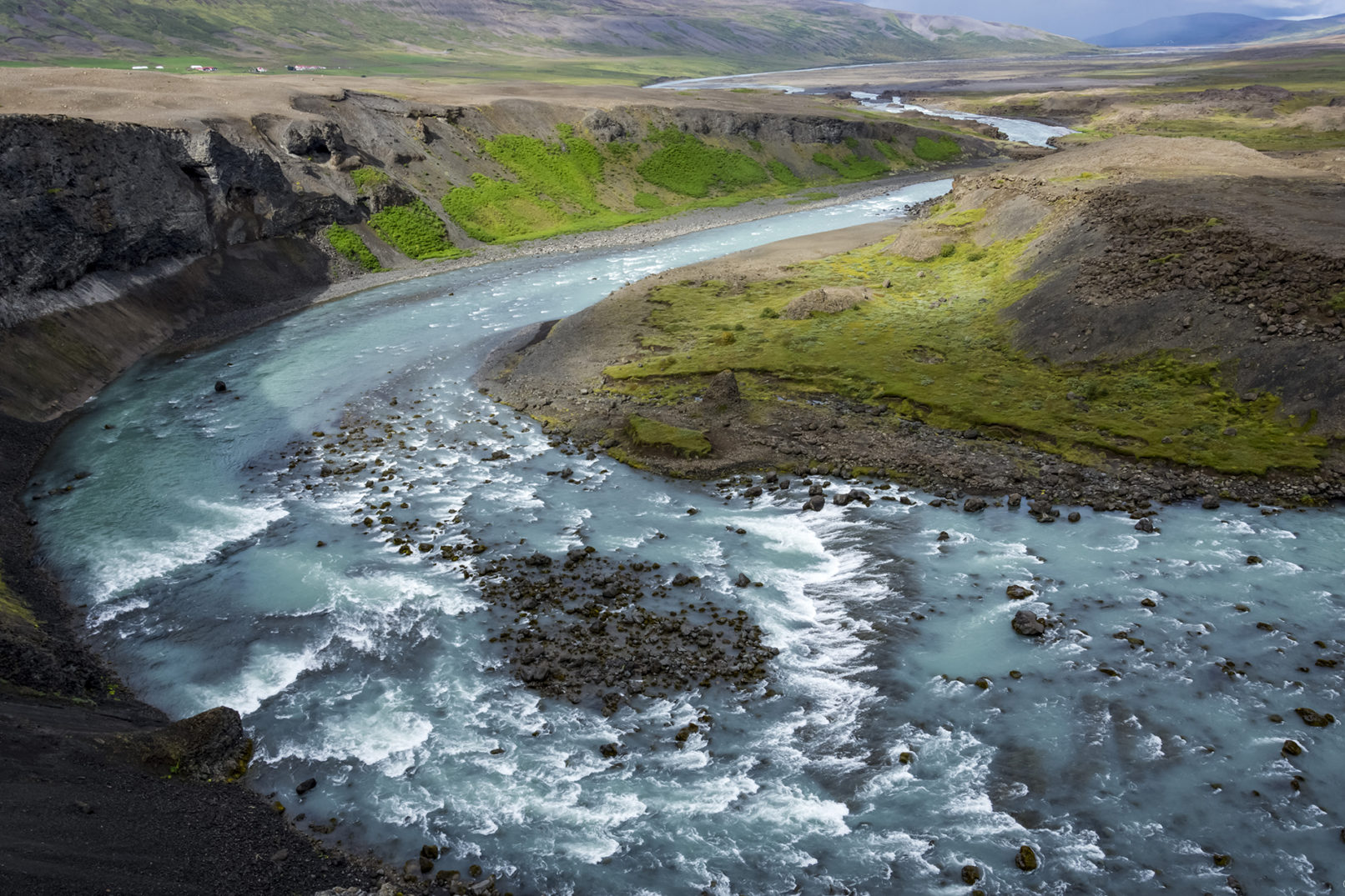 icelandic river following a rocky curve